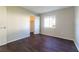 Bedroom with wood floors, large window and white walls at 4405 S Semoran Blvd # 7, Orlando, FL 32822