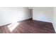 Empty bedroom with dark wood floors, and neutral paint at 4405 S Semoran Blvd # 7, Orlando, FL 32822