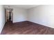 Empty bedroom with dark wood floors, and neutral paint at 4405 S Semoran Blvd # 7, Orlando, FL 32822