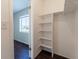 A bedroom closet features built-in shelving for optimal storage solutions at 4405 S Semoran Blvd # 7, Orlando, FL 32822