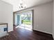 Bright dining area with wood floors, chandelier, and sliding glass doors to the outdoors at 4405 S Semoran Blvd # 7, Orlando, FL 32822