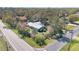 Aerial view of home surrounded by lush greenery and trees at 4898 Meadow Dr, St Cloud, FL 34772