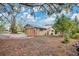 Backyard with wood privacy fence and mature trees at 4898 Meadow Dr, St Cloud, FL 34772