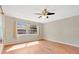 Bright bedroom with hardwood floors and a large window for natural light at 4898 Meadow Dr, St Cloud, FL 34772