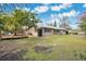 Exterior of single story house with a well manicured lawn at 4898 Meadow Dr, St Cloud, FL 34772