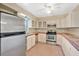 Bright kitchen with stainless steel appliances, ample counter space and a large window at 4898 Meadow Dr, St Cloud, FL 34772