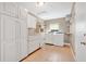 Well-organized laundry room featuring built-in storage, a washer, and a dryer at 4898 Meadow Dr, St Cloud, FL 34772