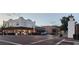 Charming neighborhood street view with local shops, brick roads, and a classic clock tower on the corner at 4898 Meadow Dr, St Cloud, FL 34772