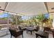 Relaxing screened-in patio furnished with comfortable seating, perfect for enjoying the outdoors at 4898 Meadow Dr, St Cloud, FL 34772