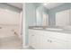 Bathroom featuring a double sink vanity and tub with shower at 515 Darshire Ave, Eustis, FL 32736