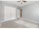 Neutral bedroom features gray walls, carpet flooring, and a double-door closet at 515 Darshire Ave, Eustis, FL 32736