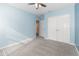 Bright bedroom with double closets and an open doorway at 515 Darshire Ave, Eustis, FL 32736