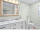 Bathroom featuring a double sink vanity with white cabinets and marble countertops at 517 Seville Ave, Altamonte Springs, FL 32714