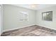 Bedroom with hardwood floors and neutral paint at 517 Seville Ave, Altamonte Springs, FL 32714