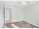 Bedroom features wood-look floors, light green walls, and closet at 517 Seville Ave, Altamonte Springs, FL 32714