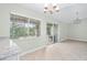 The dining area has sliding glass doors, chandelier, and a large window at 517 Seville Ave, Altamonte Springs, FL 32714