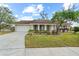 Charming single-story home with well-maintained landscaping, a two-car garage, and a welcoming front entrance at 517 Seville Ave, Altamonte Springs, FL 32714