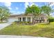 Charming single-story home with well-manicured lawn and colorful landscaping at 517 Seville Ave, Altamonte Springs, FL 32714