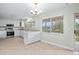 Well-lit kitchen featuring white cabinets, stainless steel appliances, and granite countertops at 517 Seville Ave, Altamonte Springs, FL 32714