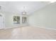 Inviting living room with tile floors, abundant natural light, and a modern light fixture at 517 Seville Ave, Altamonte Springs, FL 32714