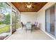 Inviting screened porch features tile floor, wood ceiling and ceiling fan, perfect for relaxing and enjoying the outdoors at 517 Seville Ave, Altamonte Springs, FL 32714