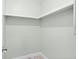 Empty walk-in closet with white walls and tile floors at 517 Seville Ave, Altamonte Springs, FL 32714