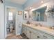 Light and airy bathroom featuring a large vanity and tiled floor at 59 Aberdeen Cir, Leesburg, FL 34788