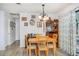 Cozy dining area adjacent to kitchen featuring laminate flooring and a view of backyard at 59 Aberdeen Cir, Leesburg, FL 34788