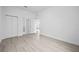 Bright bedroom featuring light wood floors, closet, and white walls at 625 Trikomo Dr, Davenport, FL 33896