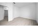 A well-lit bedroom showcases light wood flooring, offering a minimalist and modern aesthetic at 625 Trikomo Dr, Davenport, FL 33896