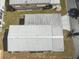 This aerial shot highlights the roof of this home with its distinctive metal roofing and mature landscaping at 7 Great Oak Dr, Fruitland Park, FL 34731