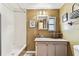 Bathroom featuring a bathtub, a window, and a vanity with painted cabinets at 7 Great Oak Dr, Fruitland Park, FL 34731