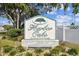 Welcome to Harbor Oaks, a vibrant 55+ resident owned community, as shown by the decorative entrance sign at 7 Great Oak Dr, Fruitland Park, FL 34731