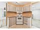 View of the kitchen featuring white oven range and microwave and lots of storage space at 7 Great Oak Dr, Fruitland Park, FL 34731