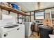 Utility room featuring a washer, dryer, shelving, and a window at 7 Great Oak Dr, Fruitland Park, FL 34731