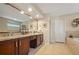 Main bathroom featuring dual sinks, granite counters, and a soaking tub at 703 E Lakeshore Dr, Ocoee, FL 34761