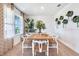 Bright dining room with a stylish table, chairs, and unique wall decor at 7104 Painted Bunting Way, St Cloud, FL 34773