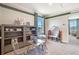 Inviting playroom with gray bookcases, neutral walls with green stripe, and -sized furniture, creating a playful space at 7104 Painted Bunting Way, St Cloud, FL 34773