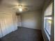 Simple bedroom with ceiling fan, closet, and good natural light from a window at 7277 Pebble Pass Loop Loop, Lakeland, FL 33810