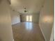 Spacious living room with neutral tile flooring, a ceiling fan, and glass doors at 7277 Pebble Pass Loop Loop, Lakeland, FL 33810