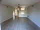 Large and open living room featuring neutral walls and tile flooring and a ceiling fan at 7277 Pebble Pass Loop Loop, Lakeland, FL 33810