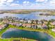 An elevated shot of this house and surrounding neighborhood located on a lake at 7515 John Hancock Dr, Winter Garden, FL 34787