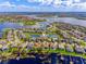 Aerial view of a waterfront community with lake and wetland views at 7515 John Hancock Dr, Winter Garden, FL 34787