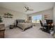 Bedroom with a ceiling fan, a comfortable bed, and a window at 7515 John Hancock Dr, Winter Garden, FL 34787