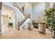 The foyer is well lit with the stairs and living room off the dining room at 7515 John Hancock Dr, Winter Garden, FL 34787