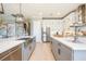 This spacious kitchen features two tone cabinets, stainless appliances and large counters at 7515 John Hancock Dr, Winter Garden, FL 34787