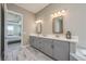 Elegant main bathroom with double vanity, modern lighting, and stylish fixtures at 7515 John Hancock Dr, Winter Garden, FL 34787