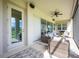 Covered patio seating area with outdoor furniture and ceiling fan at 7515 John Hancock Dr, Winter Garden, FL 34787