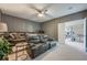 Comfortable home theater room with reclining seats and a ceiling fan at 7515 John Hancock Dr, Winter Garden, FL 34787