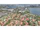 Aerial view of the community featuring red tile roofs and lush landscaping at 8218 Borgia Ct, Orlando, FL 32836